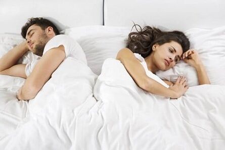 A man with a weak potency and frustrated woman in bed